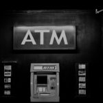 grayscale photo of ATM machine