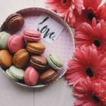 macaroons on a tray with the word 'love'