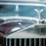 shallow focus photography of Rolls Royce emblem