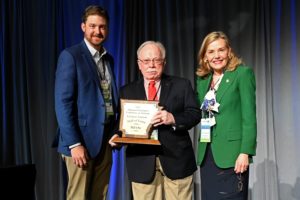  Bill Ott, center, poses with Travis Napper, Director of Arkansas Tourism