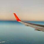 white and red airplane wing