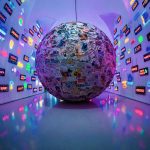 large grey, blue, and brown paper ball ball on display