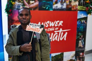 Vanuatu says Welkam Back - excited passenger