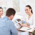 A young man and a woman came to the travel agency.