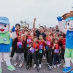 Mr Eric Chua, Senior Parliamentary Secretary for Culture, Community and Youth of Singapore, cheering with young participants at the start line of the Kids Dash