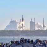 Tourists watch a rocket launch at Qishui Bay, Longlou Town, Wenchang.