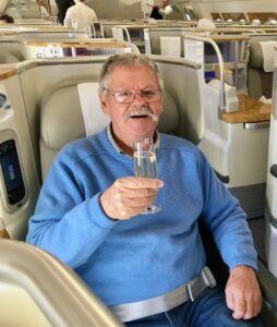 Ian McIntosh enjoying Champagne in Business Class.