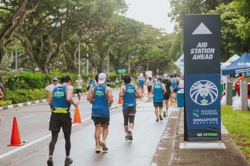 SCSM 2023 participants passing an aid station sign