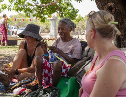 Violet Lawson teaches visitors weaving at Mayali Mulil Festival in Kakadu