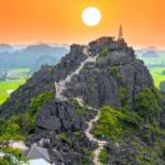 Ninh Binh, Vietnam - April 5th, 2019: Mua Cave mountain viewpoint, Stunning view of Tam Coc area with mountain range, rice fields. It is such as Great Wall in Ninh Binh, Vietnam