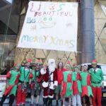 Santa Abseils Sofitel Sydney with Gifts for Charity!