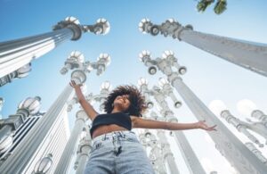 Embracing LA's luminous legacy beneath timeless lamp posts and endless blue sky - Credit Visit California