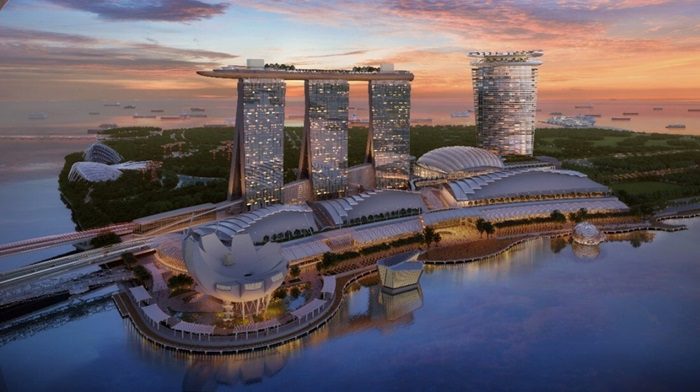 The envisioned waterfront with Las Vegas Sands’ new ultra-luxury development featuring a 55-storey hotel tower and podium with 15,000-seat arena situated adjacent to the existing Marina Bay Sands. (Image courtesy of Safdie Architects)