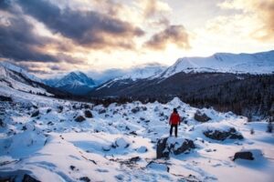 A hiker exploring mountains during winter in Banff, Alberta, Canada.