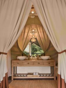 Elegant interiors feature natural materials and modern comforts, including double vanities for added convenience.