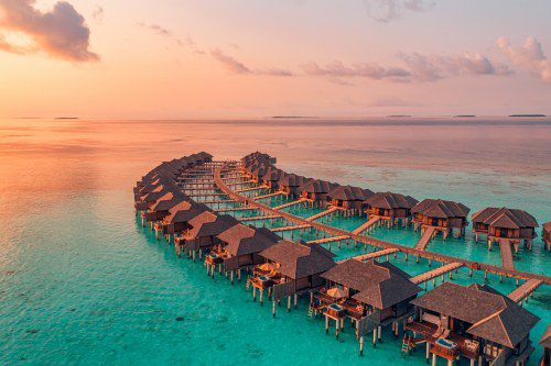 Sunset,On,Maldives,Island,,Luxury,Water,Villas,Resort,And,Wooden