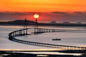 Sunset over the Incheondaegyo Bridge (longest bridge in Korea) in Incheon that connects to Incheon Airport