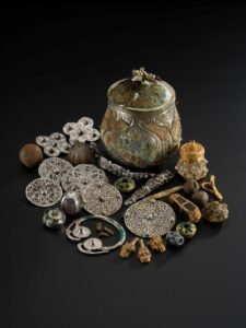 The lidded vessel from the Galloway Hoard and the Viking-age treasures it contained. Image © National Museums Scotland (2)