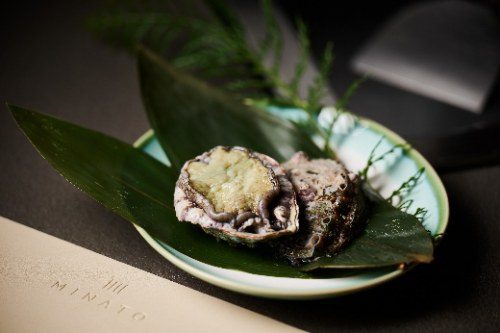 The Omakase Takeover by Nogizaka Shin menu begins with Sea Urchin & Abalone from Japan’s northern waters