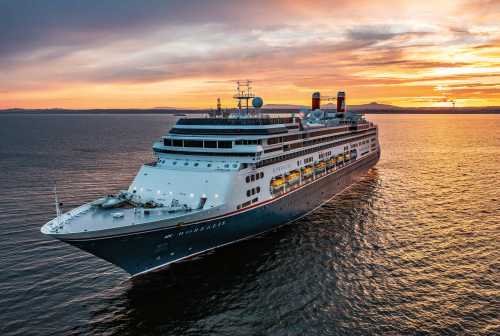 Borealis at sea at sunset