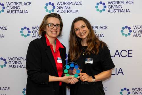 Sara King, GM of Purpose and Elise Metcalf, Advocacy PR Manager at Intrepid Travel receiving the award.