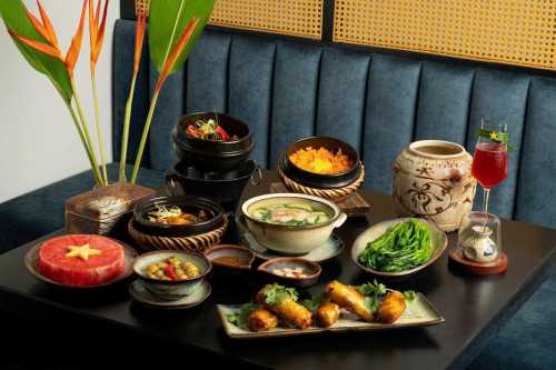 Dine at Spices Villa, a 140-year-old French colonial gem in Hanoi’s Old Quarter, serving authentic organic Vietnamese cuisine.