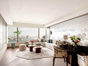 The Hong Kong Suite’s Living Room boats views of Victoria Harbour and a full-wall mural depicting Hong Kong’ origins as a fishing village