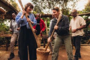 Intrepid-Travel-Tanzania-Karatu-Organic-Coffee-Farm-visit-mushing-coffee-beans-045A1588
