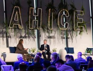 AA Deputy Chair Emma Hynes and AA CEO James Goodwin on stage at AHICE.