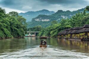 Scenic,View,Of,Longtail,Boat,Cruising,And,Rafting,On,River