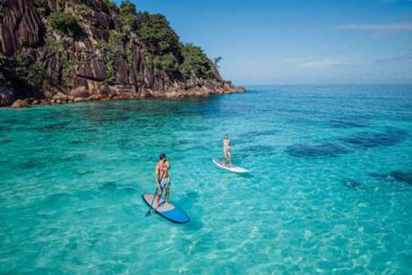 Stand-Up Paddle Boarding at Four Seasons Resort Seychelles at Desroches Island