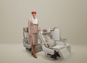 Emirates' new electric Premium Economy seat featuring integrated phone holder
