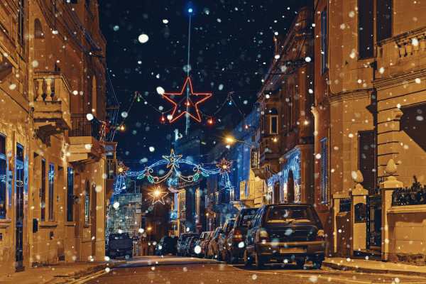 Authentic night street of old city of Malta with Christmas lights decorations and illuminations. Merry Christmas concept