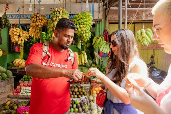 Intrepid-Travel-Sri-Lanka-Kandy-Market-Wander-and-Tasting-leader-Dodan-travellers-Maz-and-Laura
