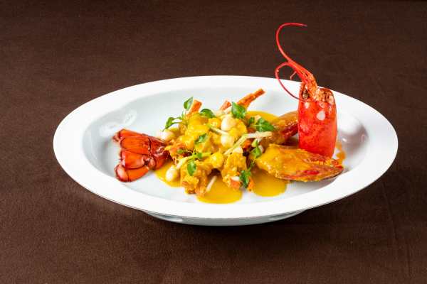 Baked Boston lobster with pumpkin golden broth